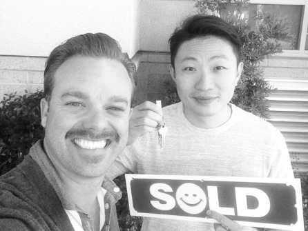 Tyler and client with "sold" sign